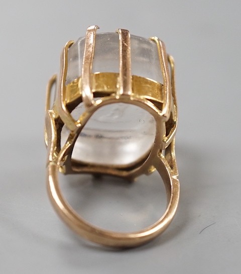 A modern 9ct gold ring, set with earlier oval rock crystal intaglio, the matrix carved with crest and the motto 'Nul Plaisir Sans Peine' size F, gross weight 10.7 grams.